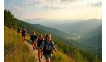 Happy group of travelers on a mountain hike overlooking Czech countryside.